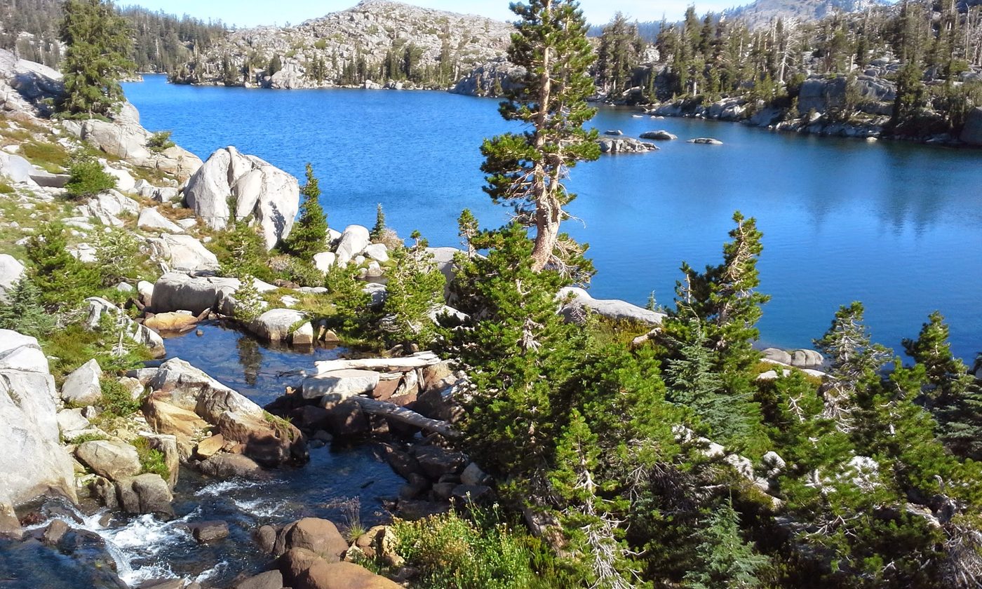 Lake Fontanillis in Desolation Wilderness, granite shoreline and still alpine water