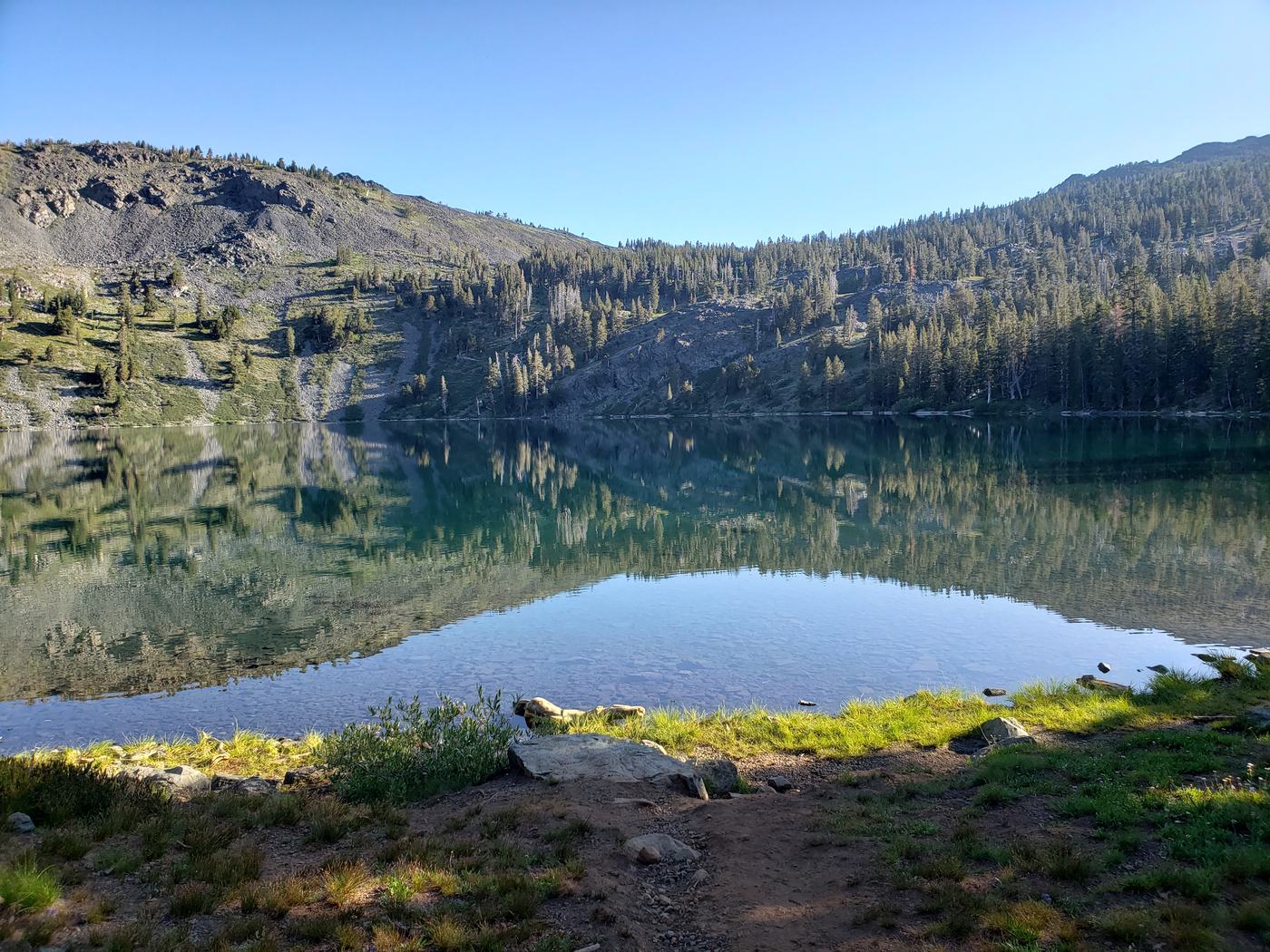 A bright morning view over an alpine lake in Desolation Wilderness, ideal for swimming