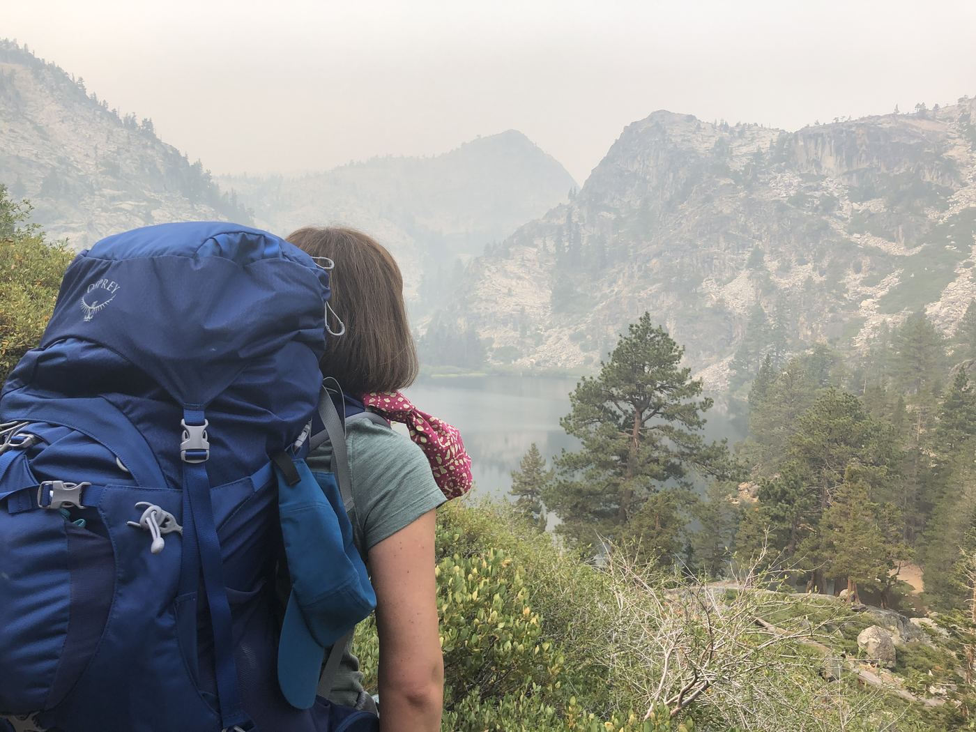 Hiking into Desolation Wilderness under a smoke-hazed sky during the Dixie Fire