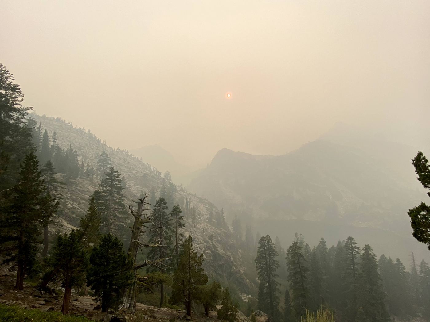 A smoke-dimmed ridgeline in Desolation Wilderness on the hike back out