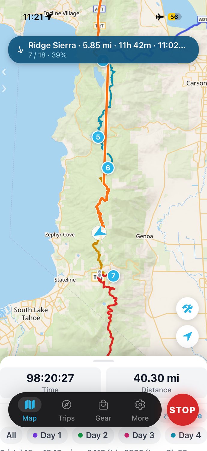 The Backpackers Friend app showing the multi-day Tahoe Rim Trail route color-coded by day, with the phone in airplane mode