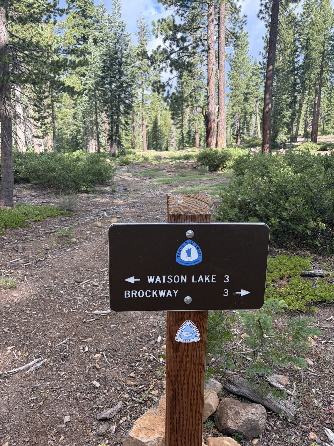 A trail sign showing Watson Lake and Brockway directions on the final leg