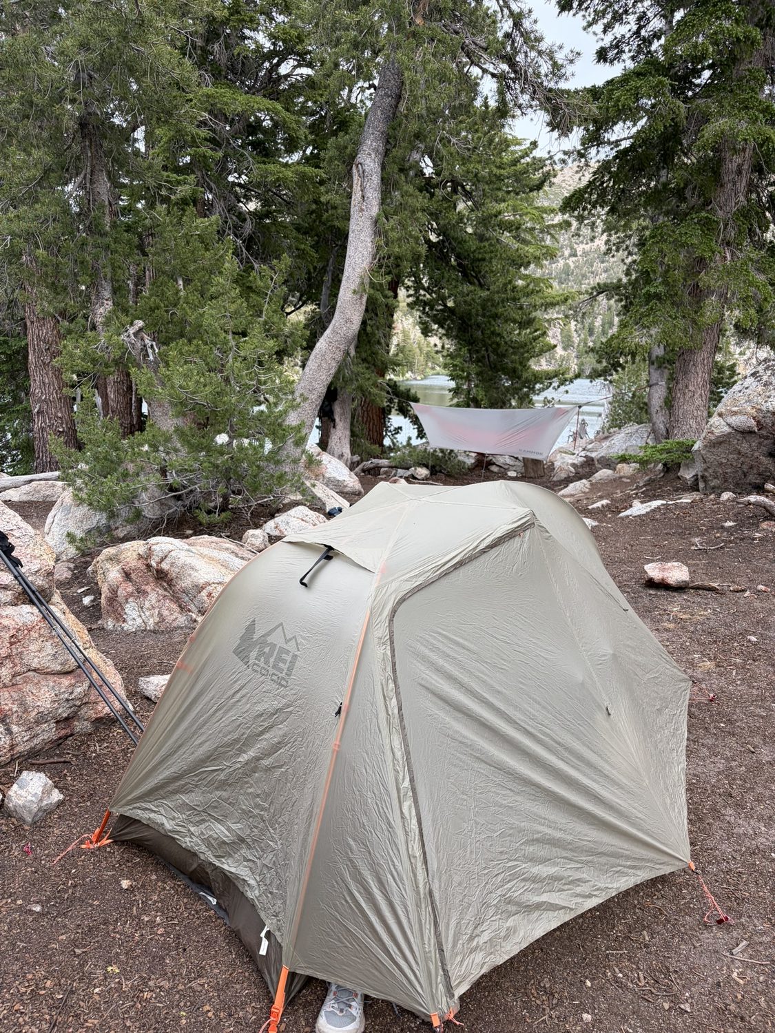 A backpacking tent pitched on granite beside the alpine Star Lake below Freel Peak