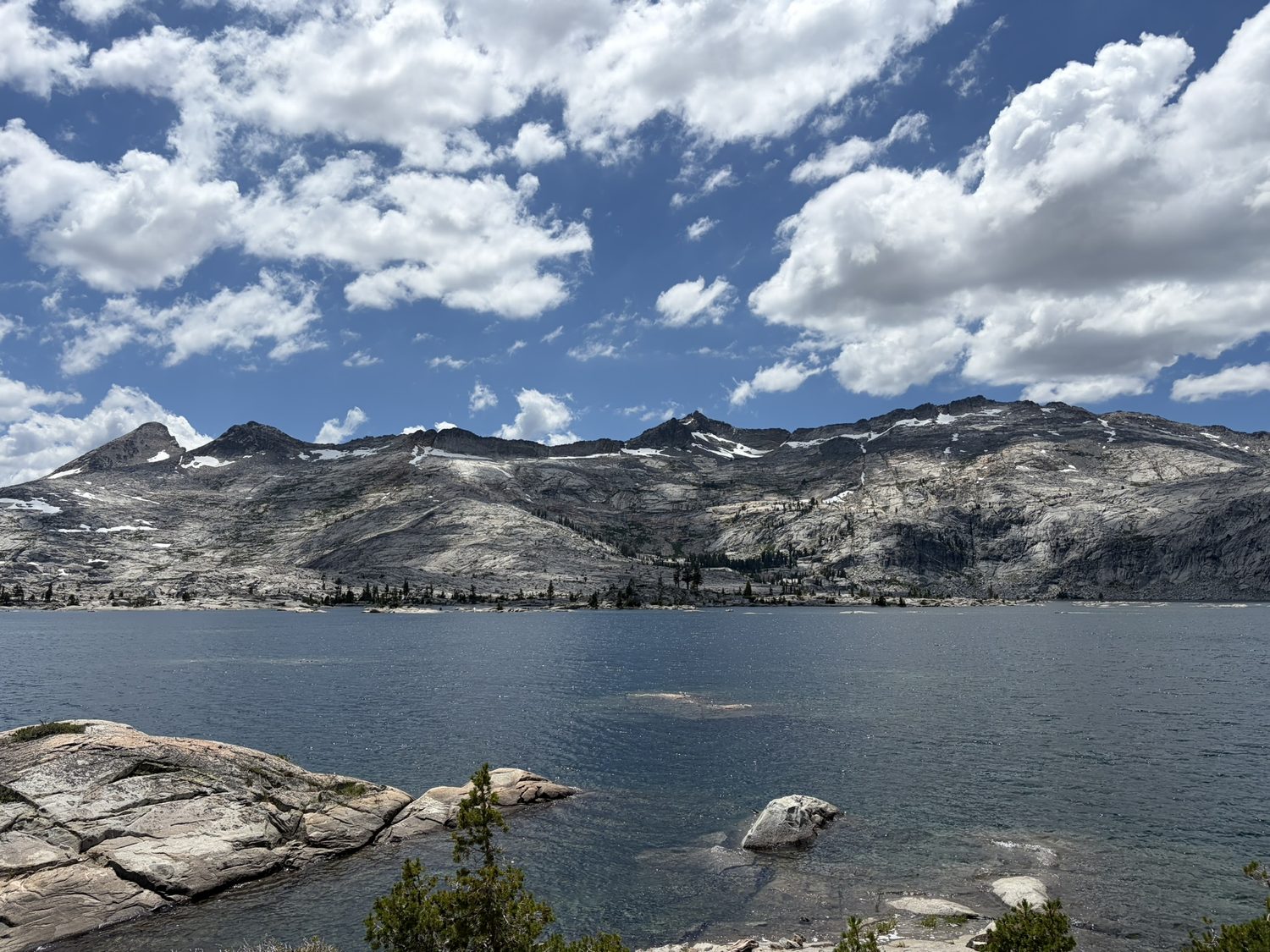 Polished granite slabs and scattered pines above the blue water of Desolation Wilderness